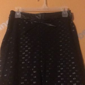 Black skirt with front split.